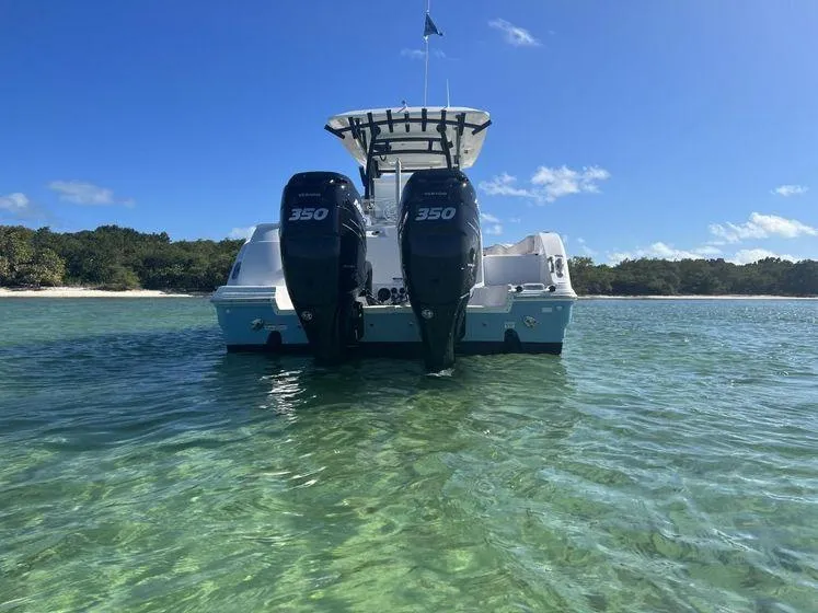 Slide: The Image of 2022 Sea Fox 328 Commander boat with twin 350 engines in clear water. - 6