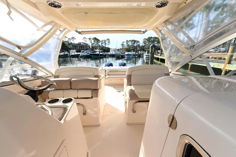 Slide: The Image of Interior view of 2014 Grady-White Freedom 307 boat, featuring seating and steering area. - 20