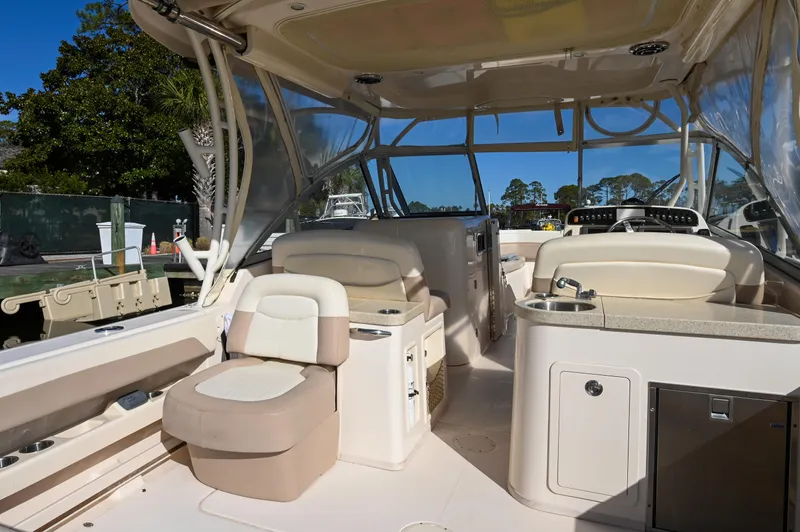 Slide: The Image of 2014 Grady-White Freedom 307 boat interior with seating and helm station. - 29
