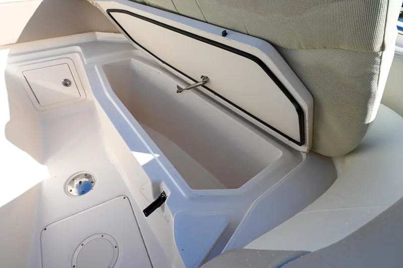 Slide: The Image of 2014 Grady-White Freedom 307 boat storage compartment with open hatch. - 36