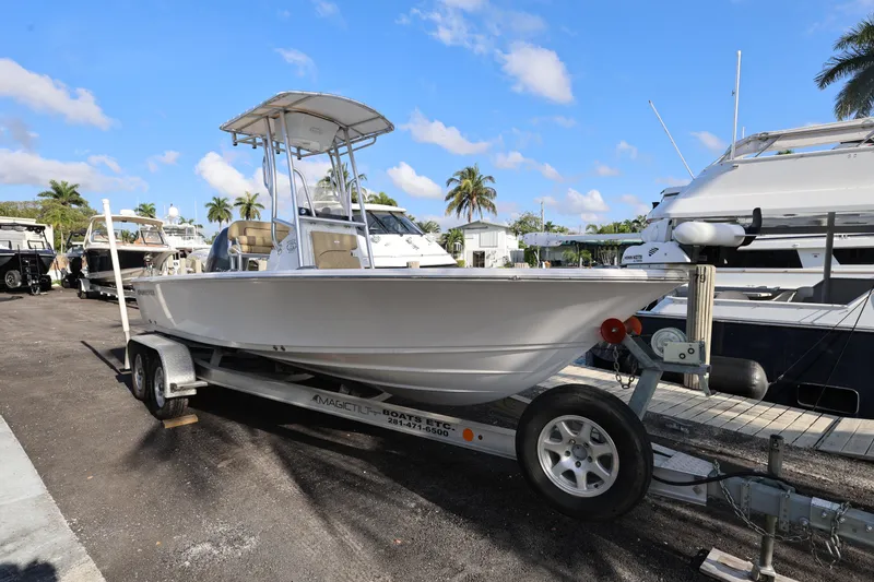 Slide: The Image of 2022 Sportsman Masters 207 Bay Boat on trailer, parked at marina. - 24