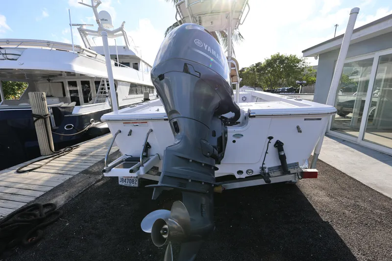 Slide: The Image of 2022 Sportsman Masters 207 Bay Boat with Yamaha outboard motor, docked at marina. - 28