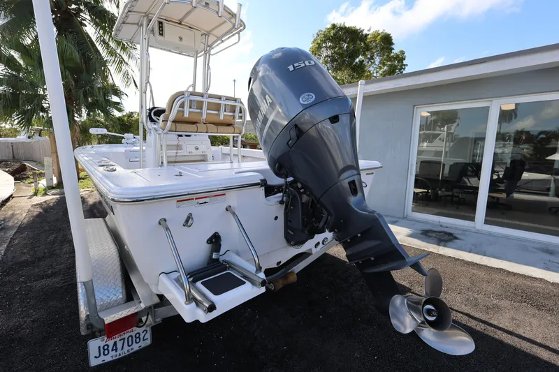 Slide: The Image of 2022 Sportsman Masters 207 Bay Boat with powerful outboard motor on trailer. - 29