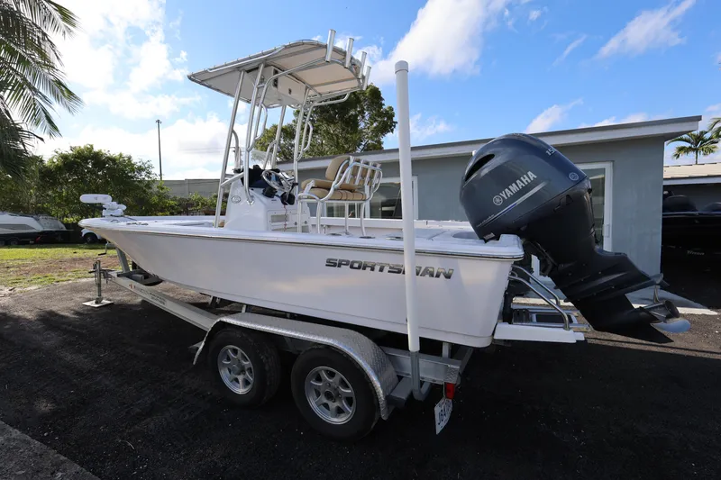 Slide: The Image of 2022 Sportsman Masters 207 Bay Boat on trailer, featuring Yamaha outboard motor. - 30