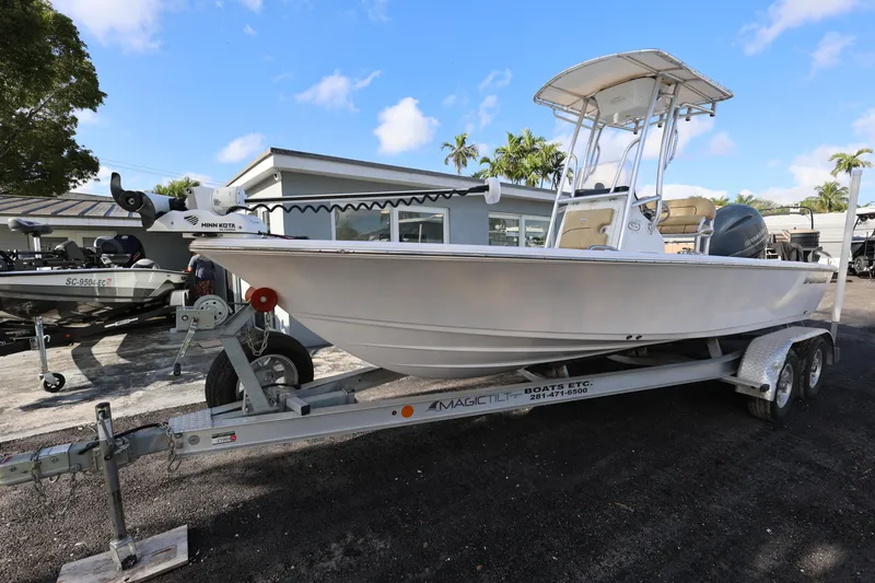 Slide: The Image of 2022 Sportsman Masters 207 Bay Boat on trailer, parked outdoors under blue sky. - 32