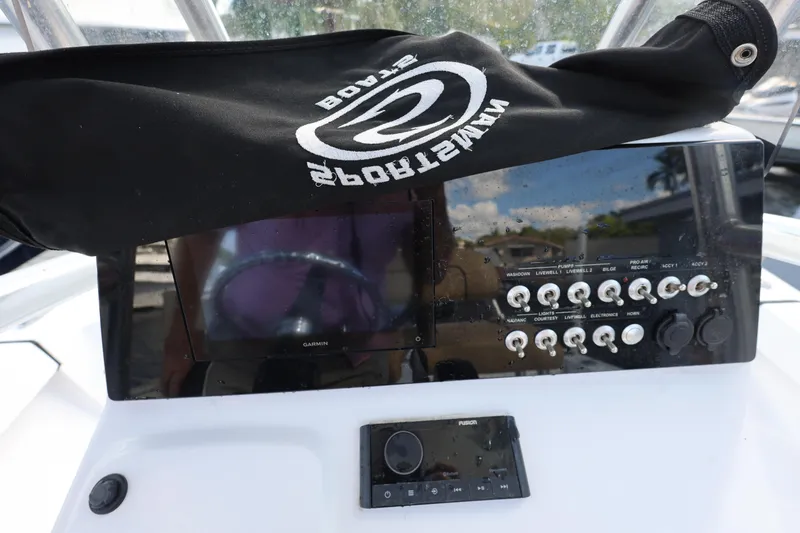 Slide: The Image of Control panel of 2022 Sportsman Masters 207 Bay Boat with covered display. - 37