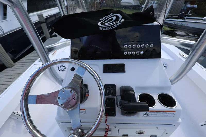 Slide: The Image of Console of 2022 Sportsman Masters 207 Bay Boat with steering wheel and controls. - 38