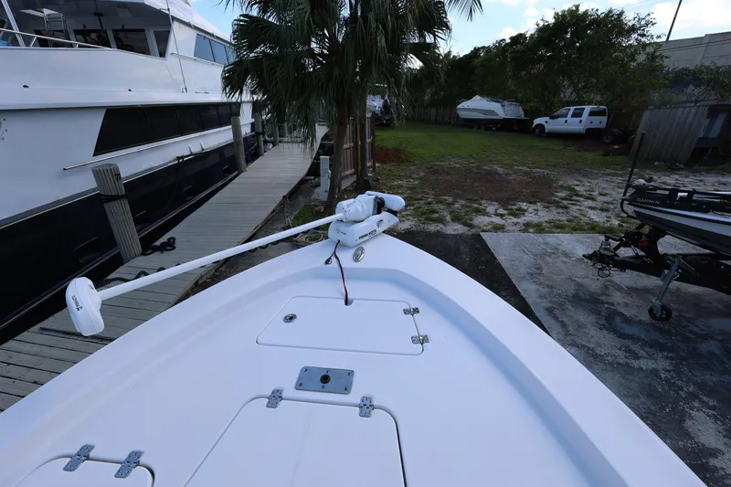 Slide: The Image of 2022 Sportsman Masters 207 Bay Boat docked near a marina. - 40