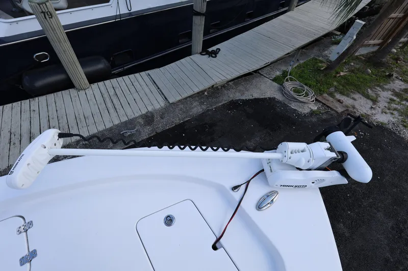 Slide: The Image of 2022 Sportsman Masters 207 Bay Boat with trolling motor at dock. - 41