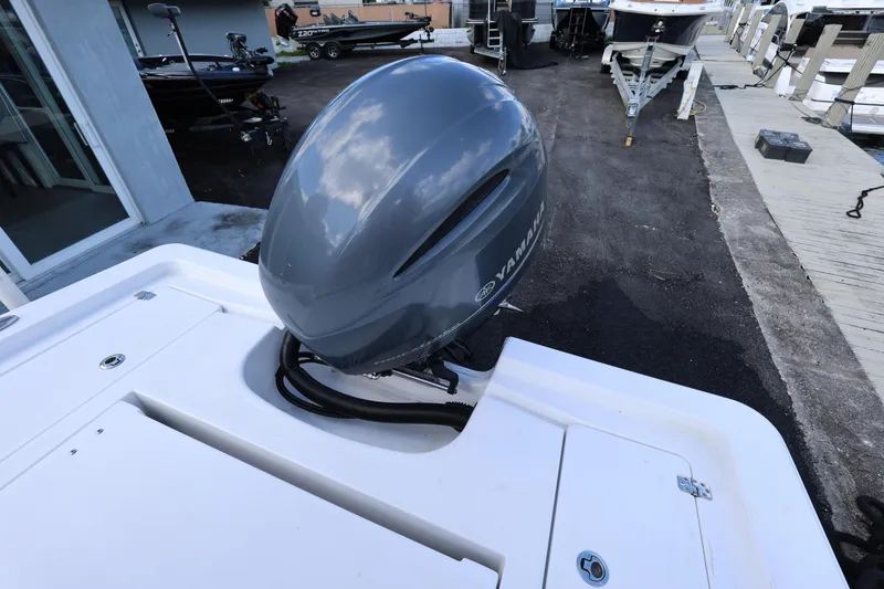 Slide: The Image of 2022 Sportsman Masters 207 Bay Boat with Yamaha outboard motor, docked at marina. - 47