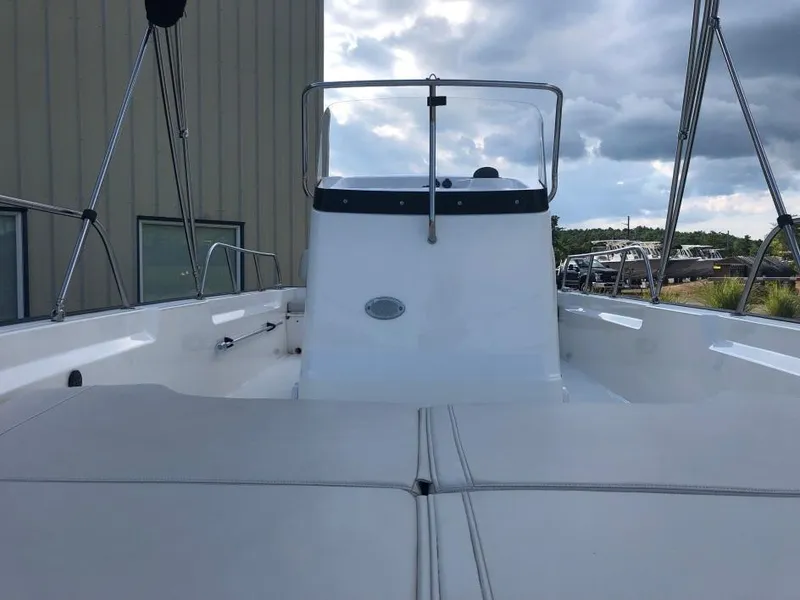 Slide: The Image of 2024 Boston Whaler 190 Montauk boat interior with console and seating. - 4