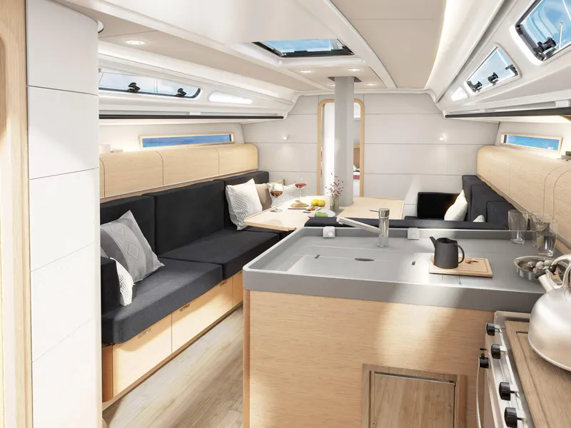 Slide: The Image of Interior of 2025 Dehler 38SQ yacht, featuring modern kitchen and cozy seating area. - 13