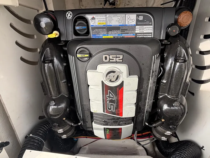 Slide: The Image of 2021 Sea Ray SPX 230 engine compartment with 250 horsepower 4.5L engine. - 26