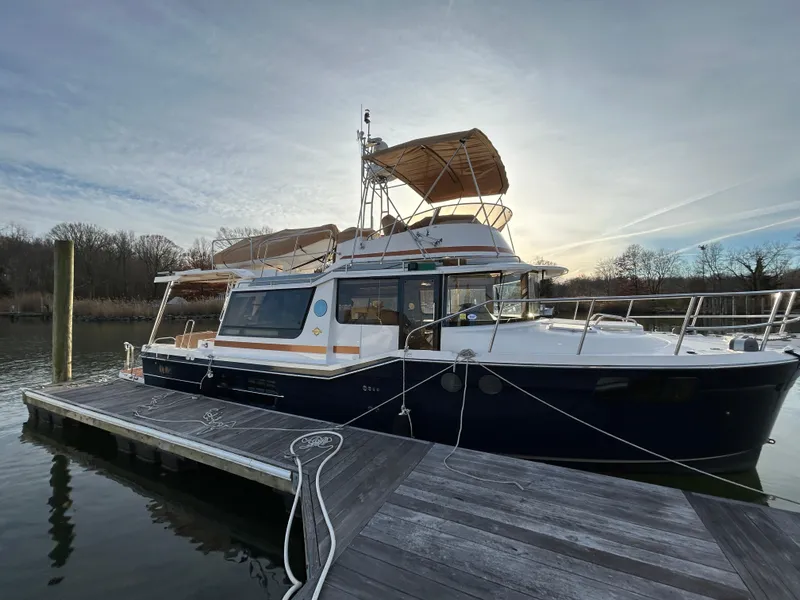 Slide: The Image of 2023 Ranger Tugs R-43 CB docked, showcasing sleek design and modern features. - 0
