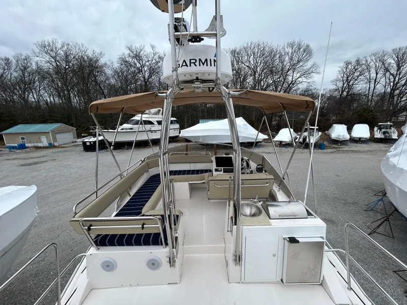 Slide: The Image of 2023 Ranger Tugs R-43 CB boat with spacious deck and seating area, parked outdoors. - 10