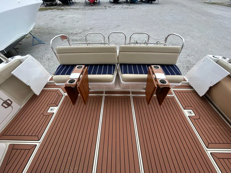 Slide: The Image of 2023 Ranger Tugs R-43 CB boat deck with cushioned seating and wooden flooring. - 3