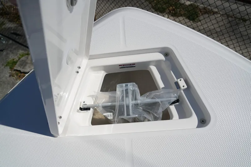 Slide: The Image of Open storage compartment on 2025 Robalo R232 EX boat. - 10