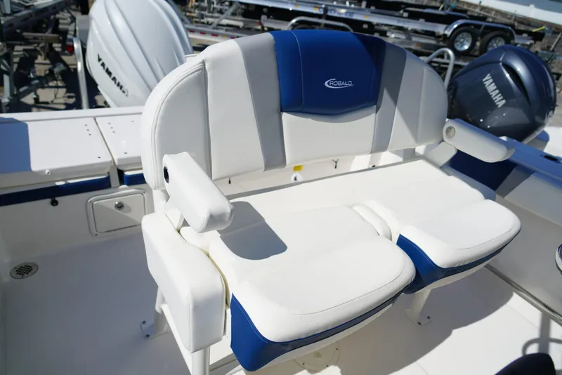 Slide: The Image of 2025 Robalo R232 EX boat seating with Yamaha engine in background. - 13