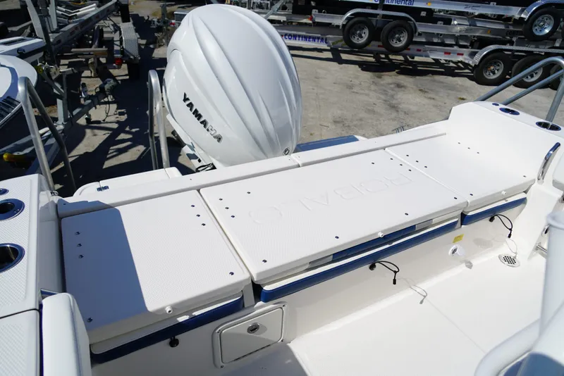 Slide: The Image of 2025 Robalo R232 EX boat deck with Yamaha engine, featuring spacious seating and storage. - 16