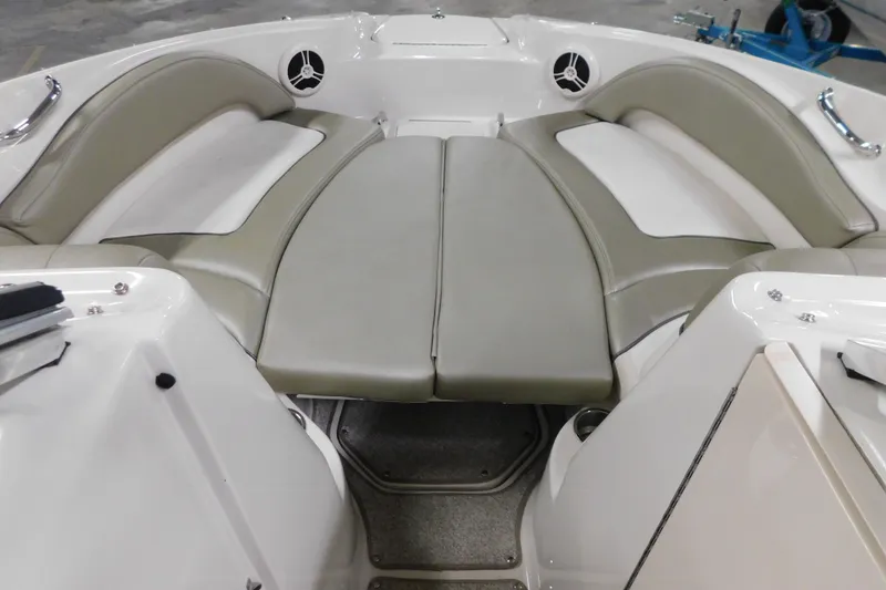 Slide: The Image of 2007 Sea Ray 220 Sundeck interior with cushioned seating and speaker system. - 11