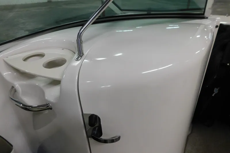 Slide: The Image of 2007 Sea Ray 220 Sundeck interior detail with cup holders and sleek design. - 13