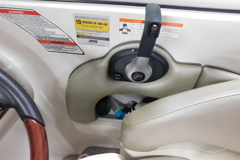 Slide: The Image of Control panel of a 2007 Sea Ray 220 Sundeck boat with capacity warnings. - 15