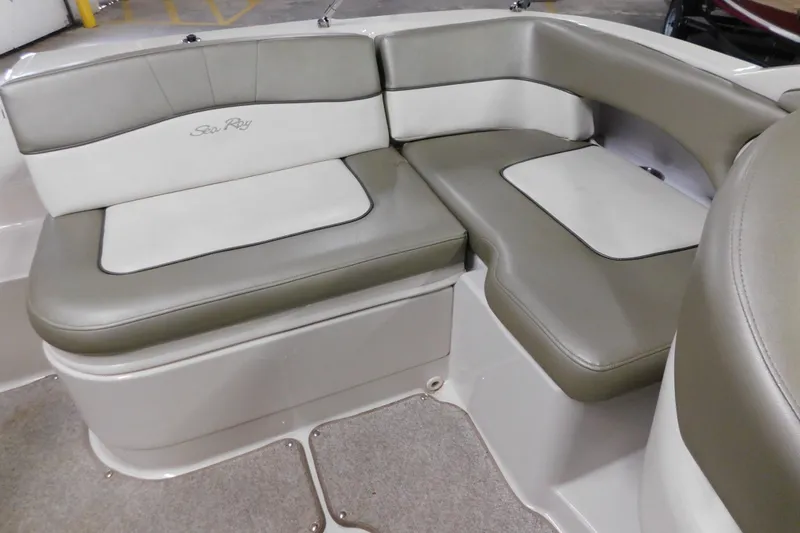 Slide: The Image of 2007 Sea Ray 220 Sundeck interior seating with beige and white upholstery. - 20