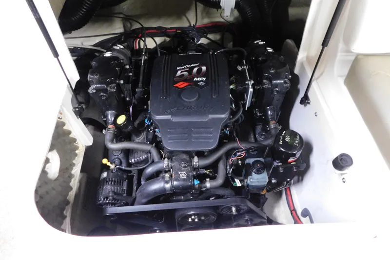 Slide: The Image of Engine compartment of a 2007 Sea Ray 220 Sundeck boat, featuring a MerCruiser 5.0 MPI engine. - 22
