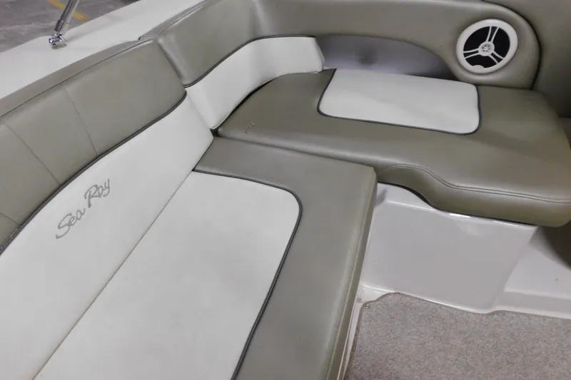 Slide: The Image of 2007 Sea Ray 220 Sundeck interior seating with logo and speaker detail. - 24