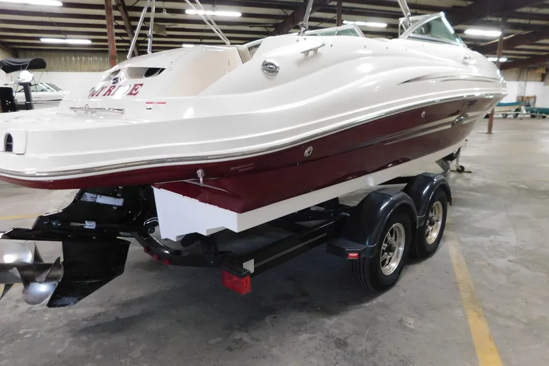 Slide: The Image of 2007 Sea Ray 220 Sundeck boat on trailer in indoor storage facility. - 27