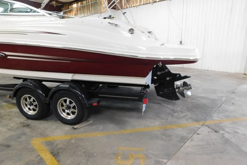 Slide: The Image of 2007 Sea Ray 220 Sundeck on trailer in indoor storage facility. - 6