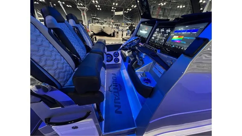 Slide: The Image of Interior of 2025 Fountain 43 SCX boat with illuminated dashboard and seating. - 17