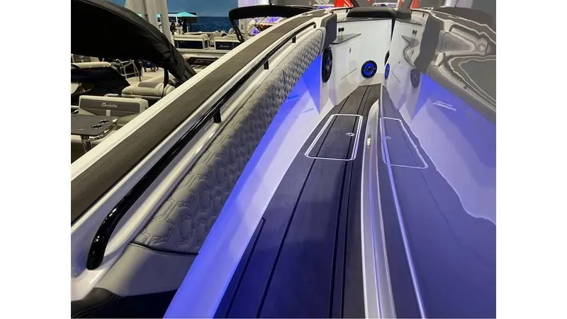 Slide: The Image of 2025 Fountain 43 SCX boat interior with sleek design and ambient blue lighting. - 19