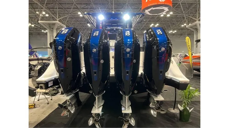 Slide: The Image of 2025 Fountain 43 SCX boat with four powerful outboard engines displayed at a boat show. - 4