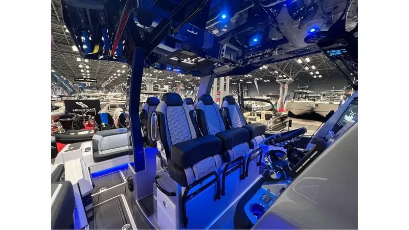 Slide: The Image of 2025 Fountain 43 SCX boat interior with modern seating and blue ambient lighting. - 9