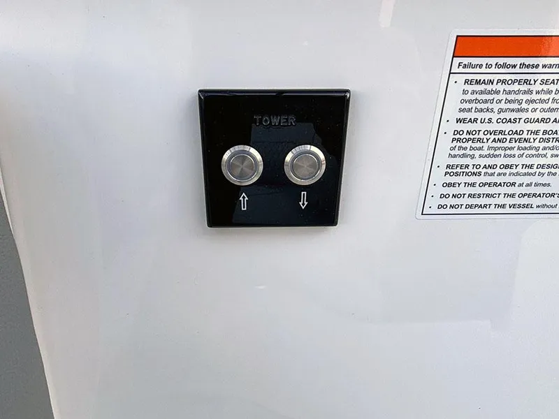 Slide: The Image of Control panel on 2025 Sea Ray SLX 260 Outboard boat with warning label. - 13