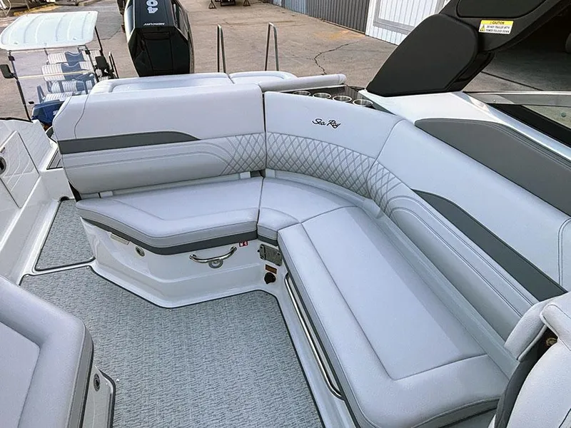 Slide: The Image of 2025 Sea Ray SLX 260 Outboard boat with luxurious gray seating and modern design. - 14