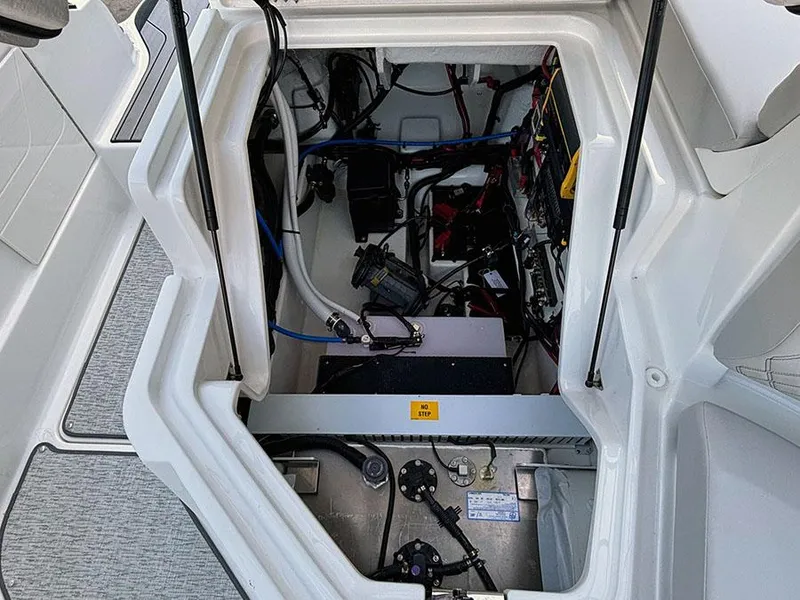 Slide: The Image of 2025 Sea Ray SLX 260 Outboard engine compartment, showcasing internal components and wiring. - 15