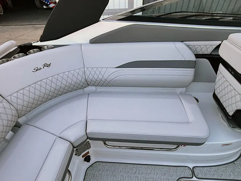 Slide: The Image of 2025 Sea Ray SLX 260 Outboard boat interior with luxurious white seating and elegant design. - 16