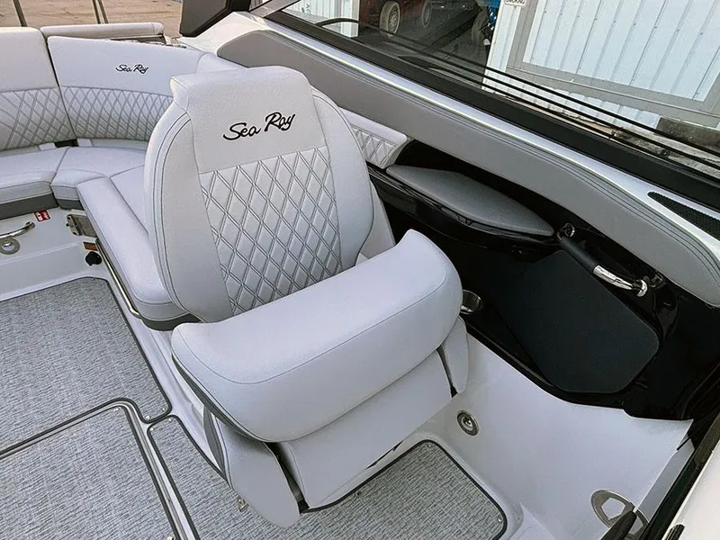 Slide: The Image of Luxurious interior of 2025 Sea Ray SLX 260 Outboard with plush seating and elegant design. - 19