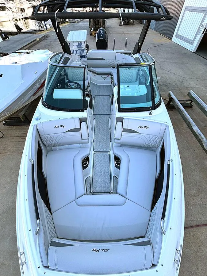Slide: The Image of 2025 Sea Ray SLX 260 Outboard boat with sleek seating and modern design. - 38