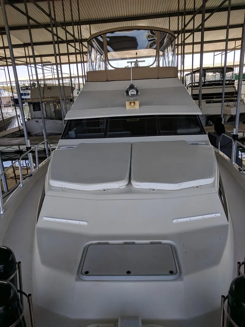 Slide: The Image of 1989 Mainship 41 Grand Salon yacht in covered marina, front view. - 14