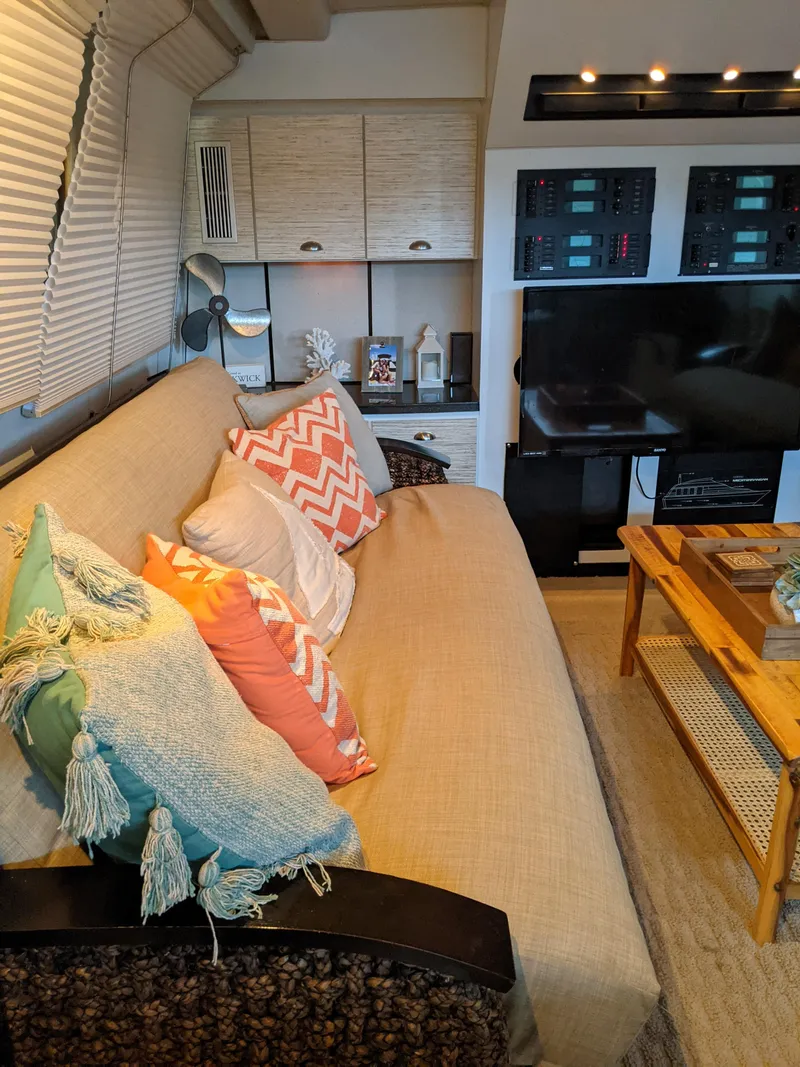 Slide: The Image of Interior of 1989 Mainship 41 Grand Salon with cozy seating and modern decor. - 43