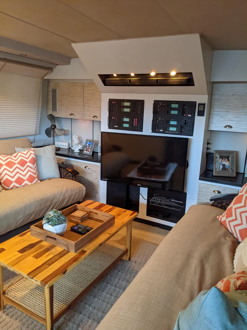 Slide: The Image of Interior of 1989 Mainship 41 Grand Salon with modern decor and entertainment setup. - 45