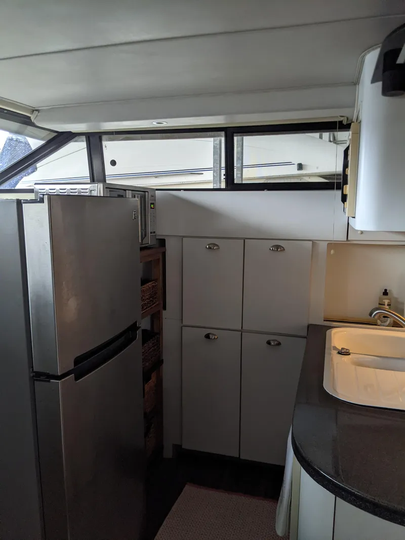 Slide: The Image of 1989 Mainship 41 Grand Salon kitchen with modern appliances and ample storage. - 49