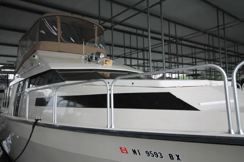 Slide: The Image of 1989 Mainship 41 Grand Salon yacht docked in a covered marina. - 5