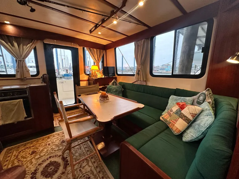 Slide: The Image of Interior of 2001 Nordic Tug 37 with cozy seating and nautical decor. - 19