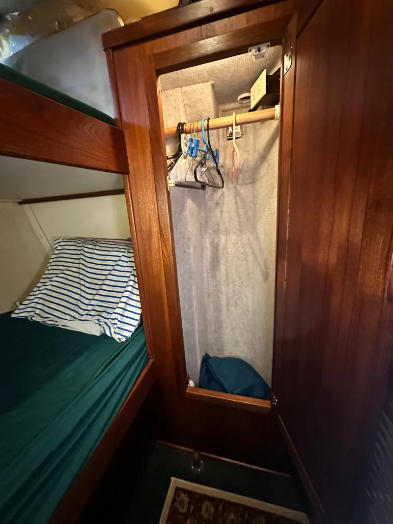 Slide: The Image of Wooden closet and bunk bed in 2001 Nordic Tug 37 boat interior. - 45