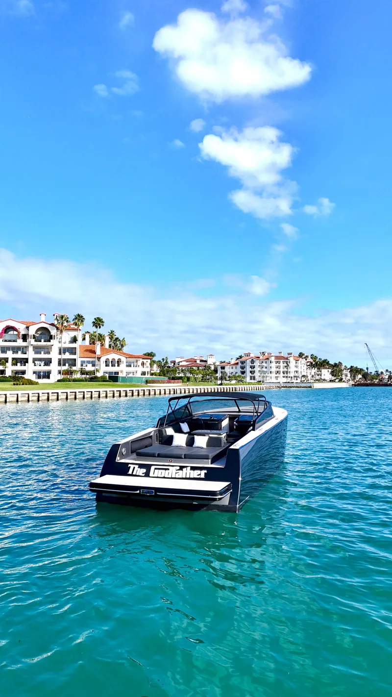 Slide: The Image of 2014 VanDutch 55 yacht cruising in sunny coastal waters. - 10