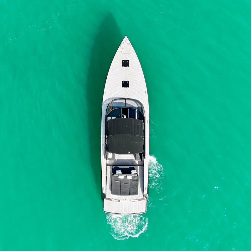 Slide: The Image of Aerial view of 2014 VanDutch 55 yacht on turquoise water. - 14